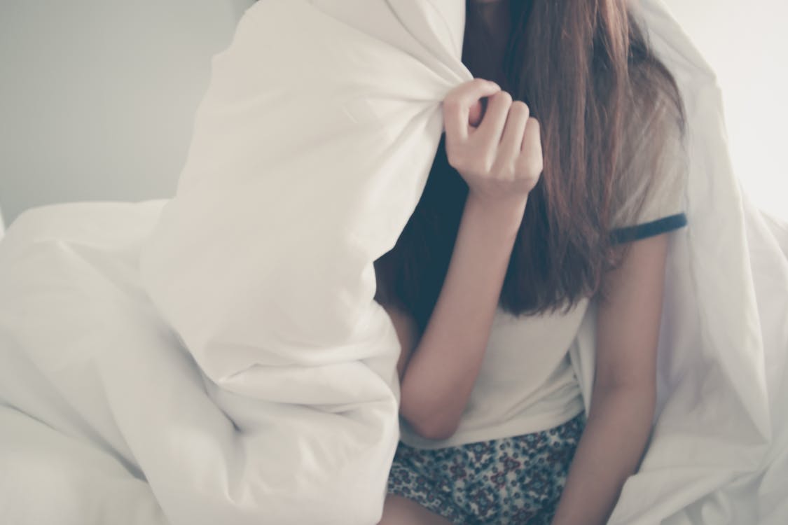 Woman Under Comforter