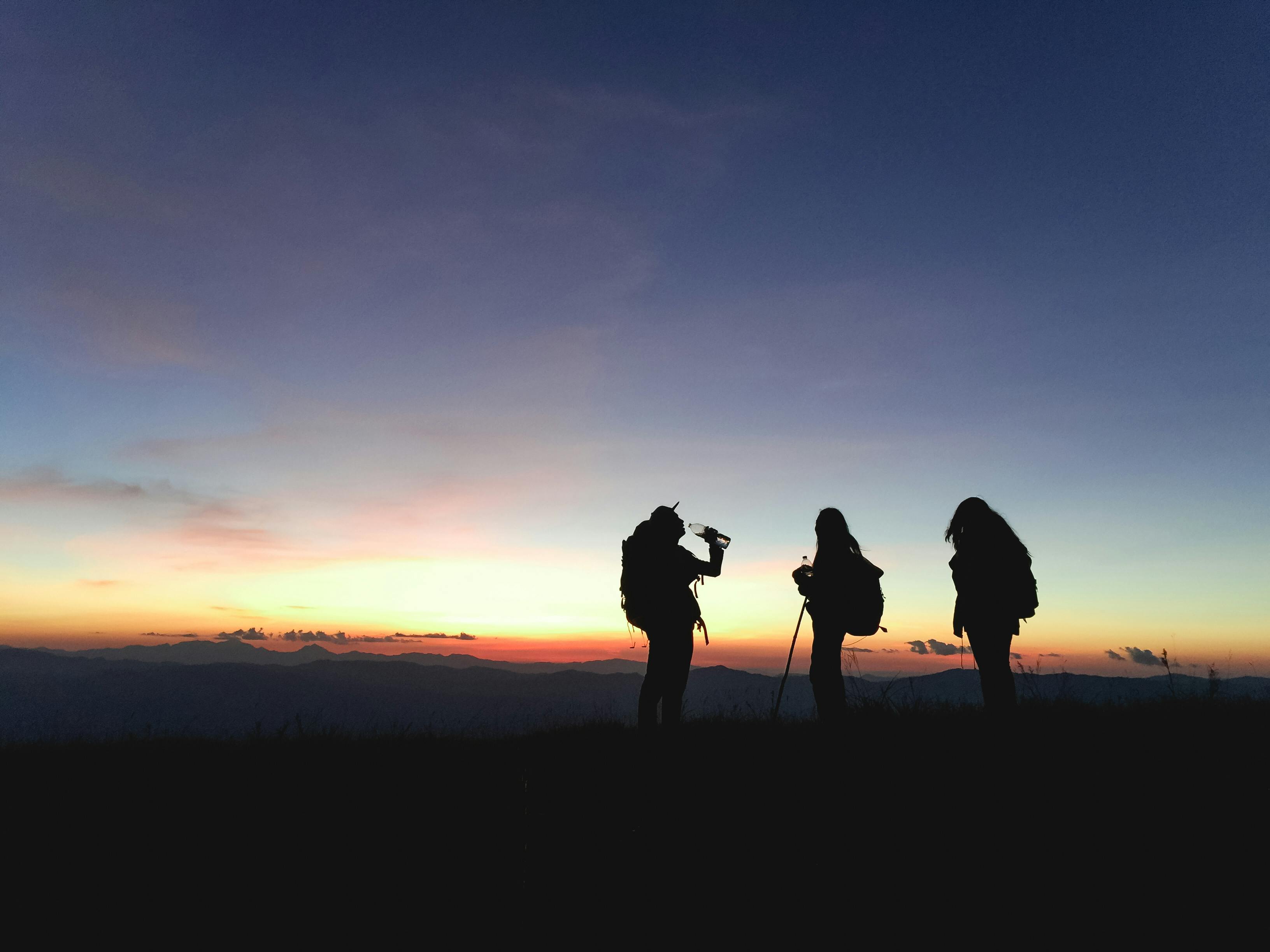 Silhouette of Three People · Free Stock Photo