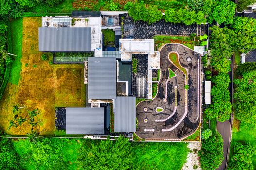 Aerial shot of a modern building complex surrounded by greenery in South Jakarta, Indonesia.