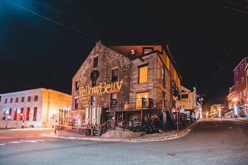 Old restaurant facade on empty city street at night