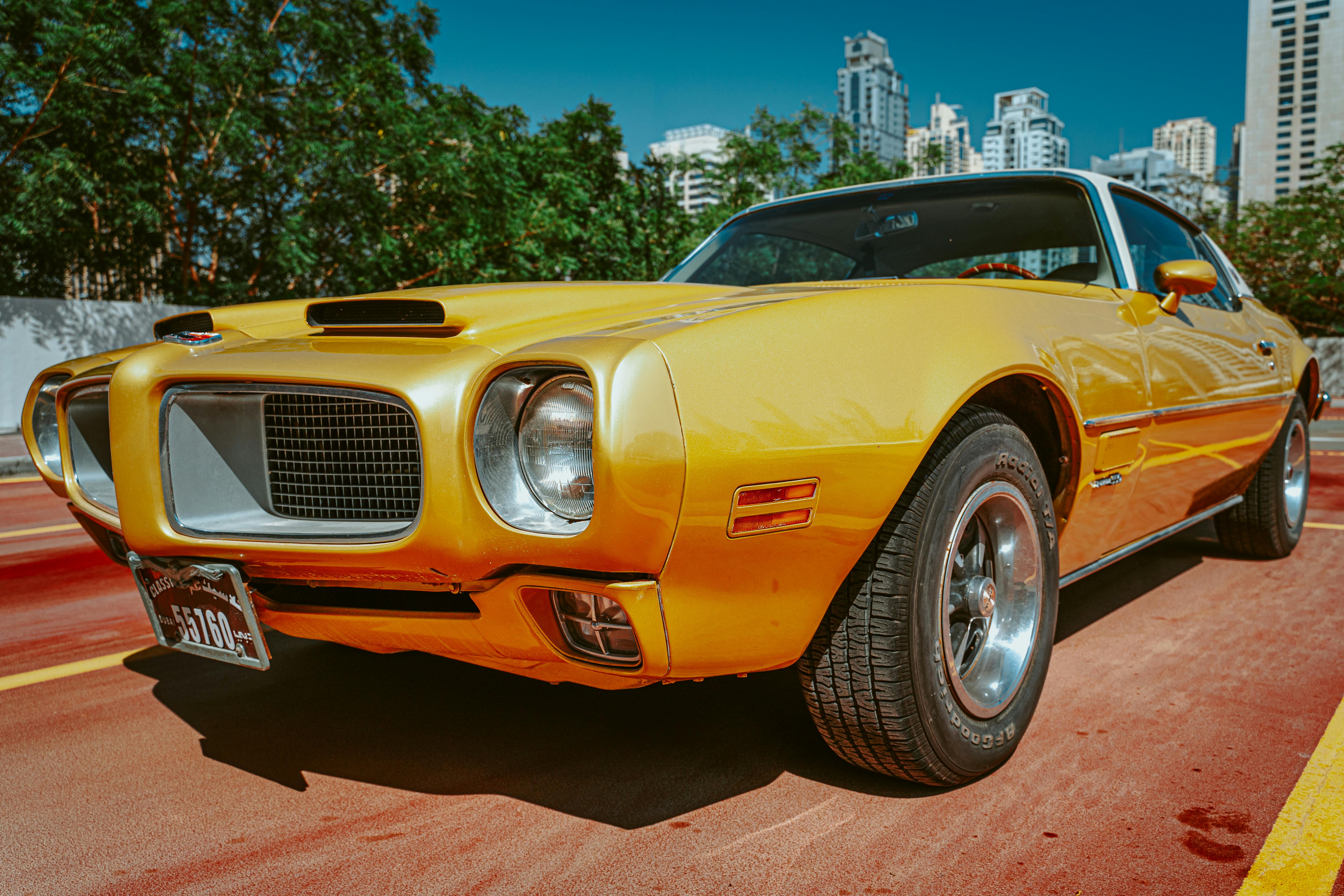 Yellow and Black Muscle Car Parked during Daytime · Free Stock Photo