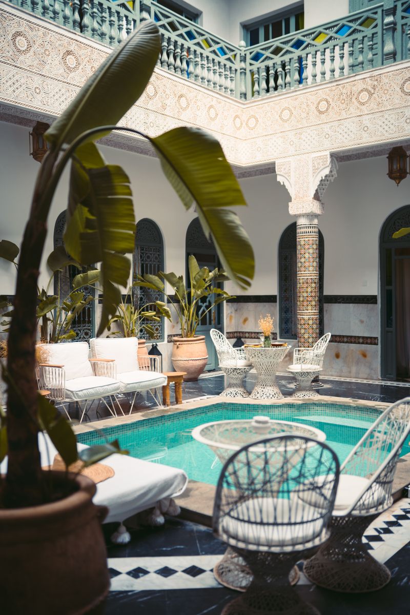 Patio of a hidden riad in Marrakech with zellige and private pool