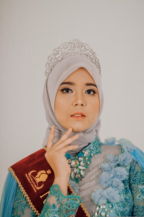 Photo of Woman Wearing Hijab and Crown