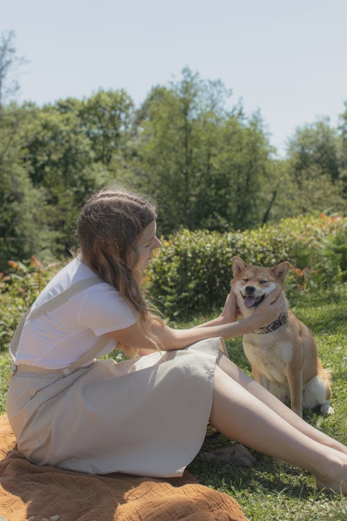 Woman Petting her Adorable Pet Dog