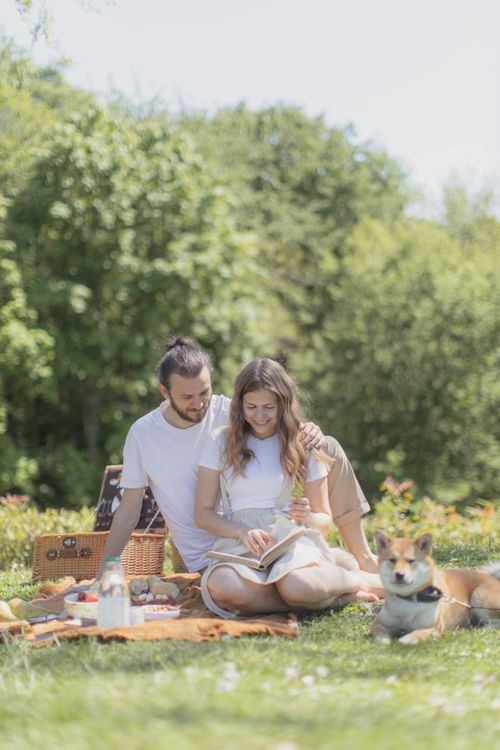 Couple Having a Picnic with their Dog · Free Stock Photo