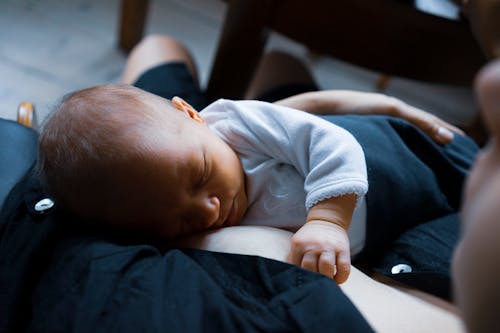 Free Photo of Baby on Mother's Arm Stock Photo