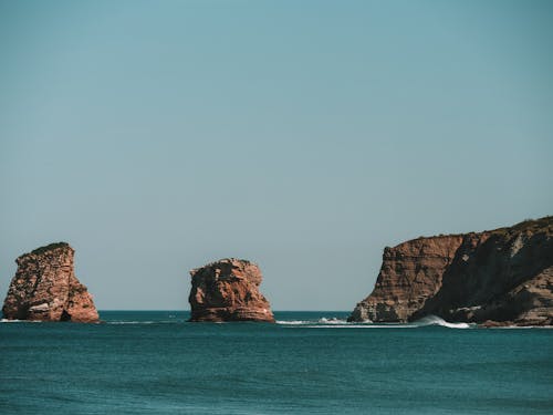 Brown Rock Formation on Sea