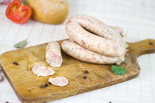 Free White Sausage on Brown Wooden Chopping Board Stock Photo