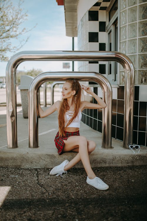 Woman Sitting Steel Railing