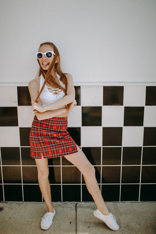 Woman Posing in a Tiled Wall