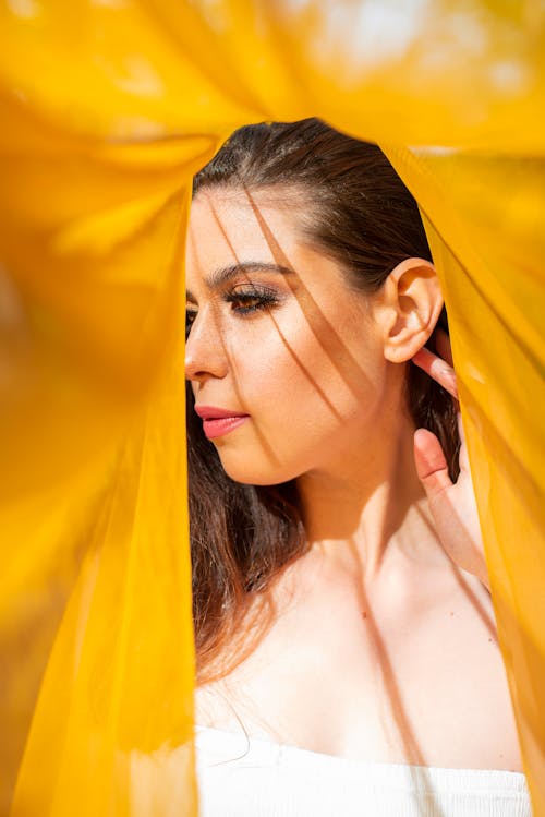 Photo of a Woman Through a Yellow Hole