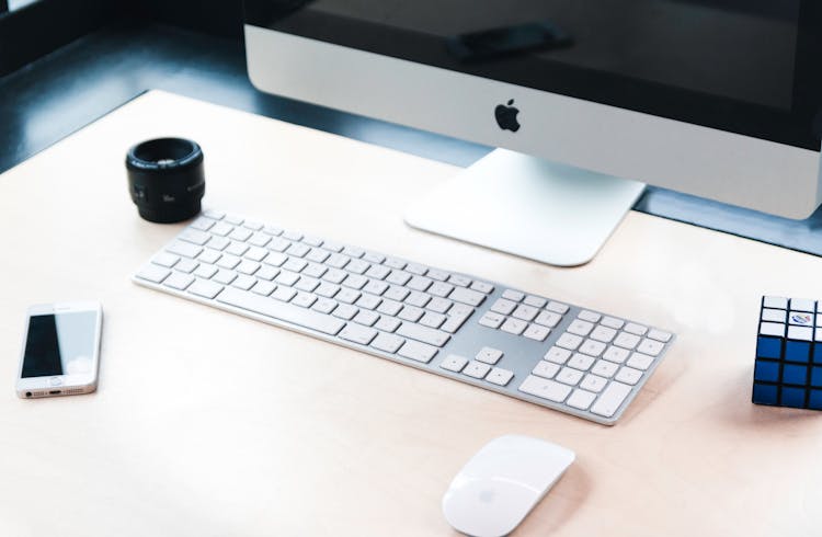 Imac Beside Apple Wireless Keyboard And Magic Mouse