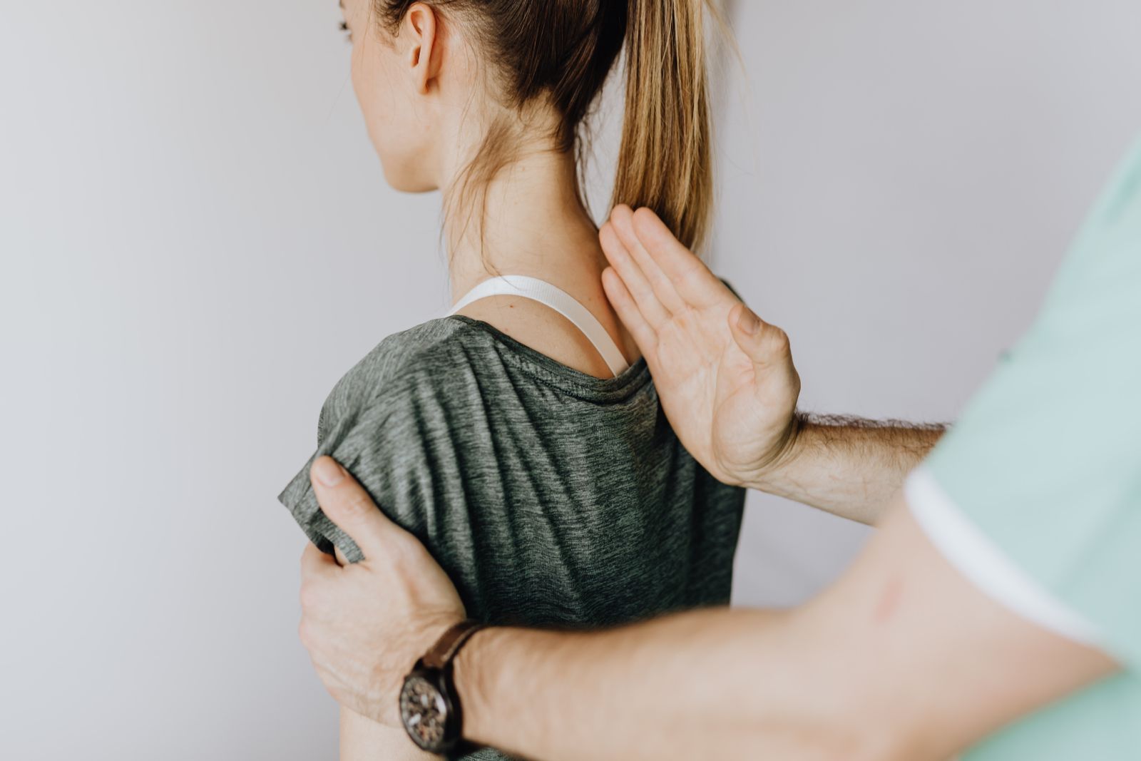 Clinician measuring a person's torso and back for brace sizing