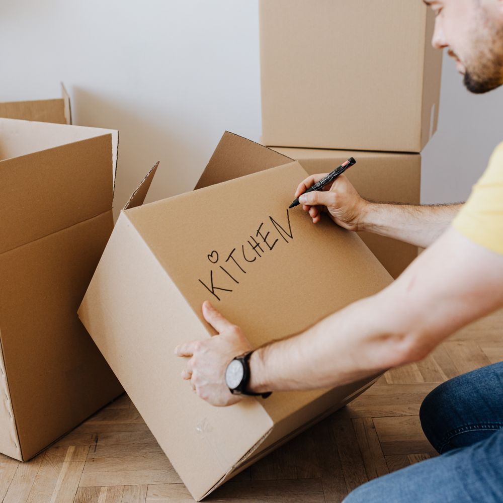 Sutton — professional packers wrapping and boxing belongings