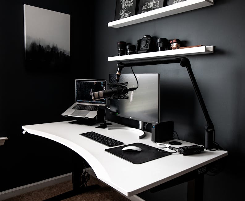 Ultimate Home Automation Routine Setup Myths for 2025 Contemporary style workspace with netbook near computer and microphone on white table in room with dark walls