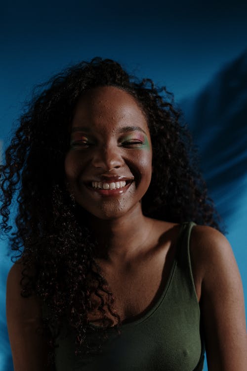 Smiling Woman in Green Tank Top