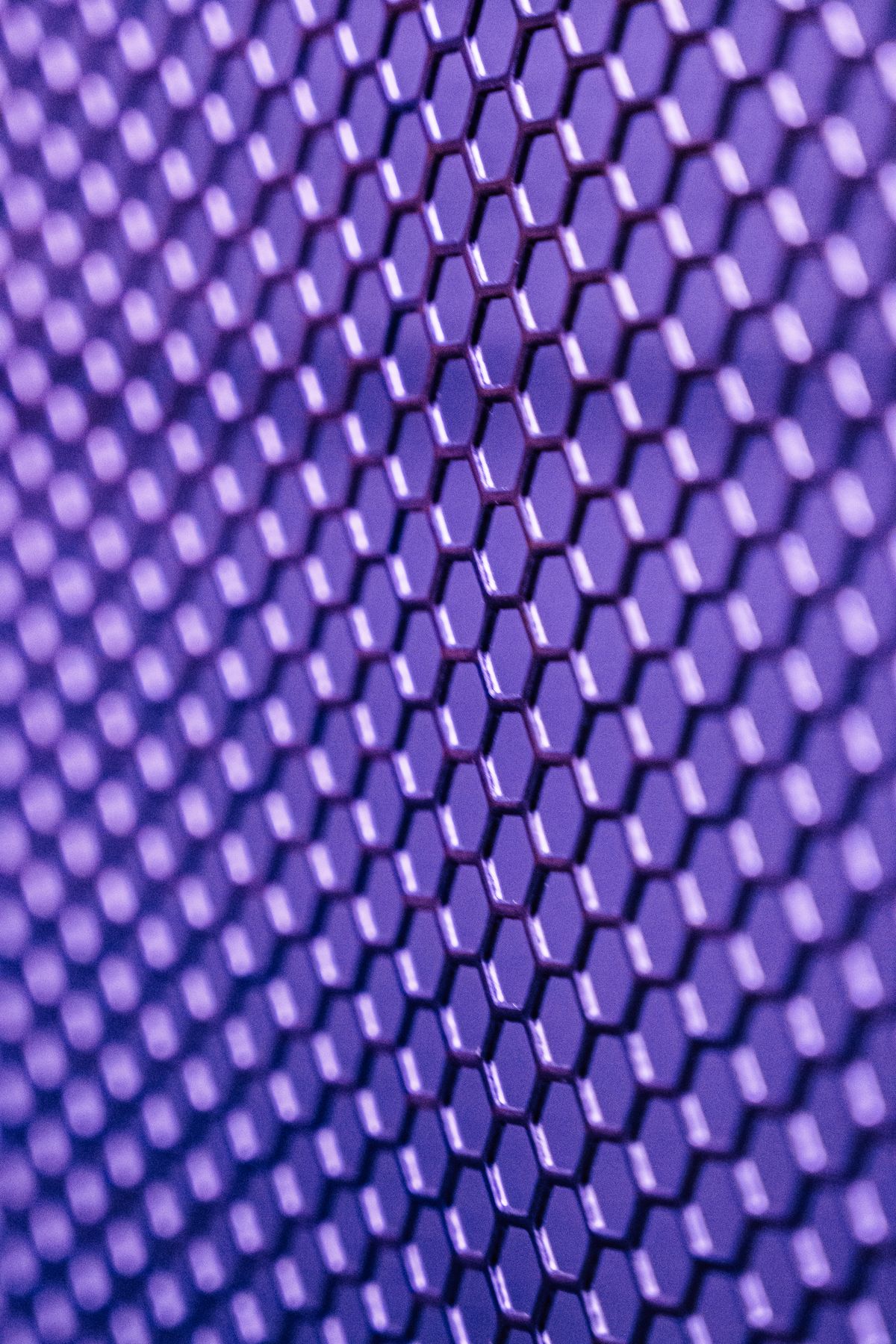 A complex geometric metal lattice pattern evoking generative design output