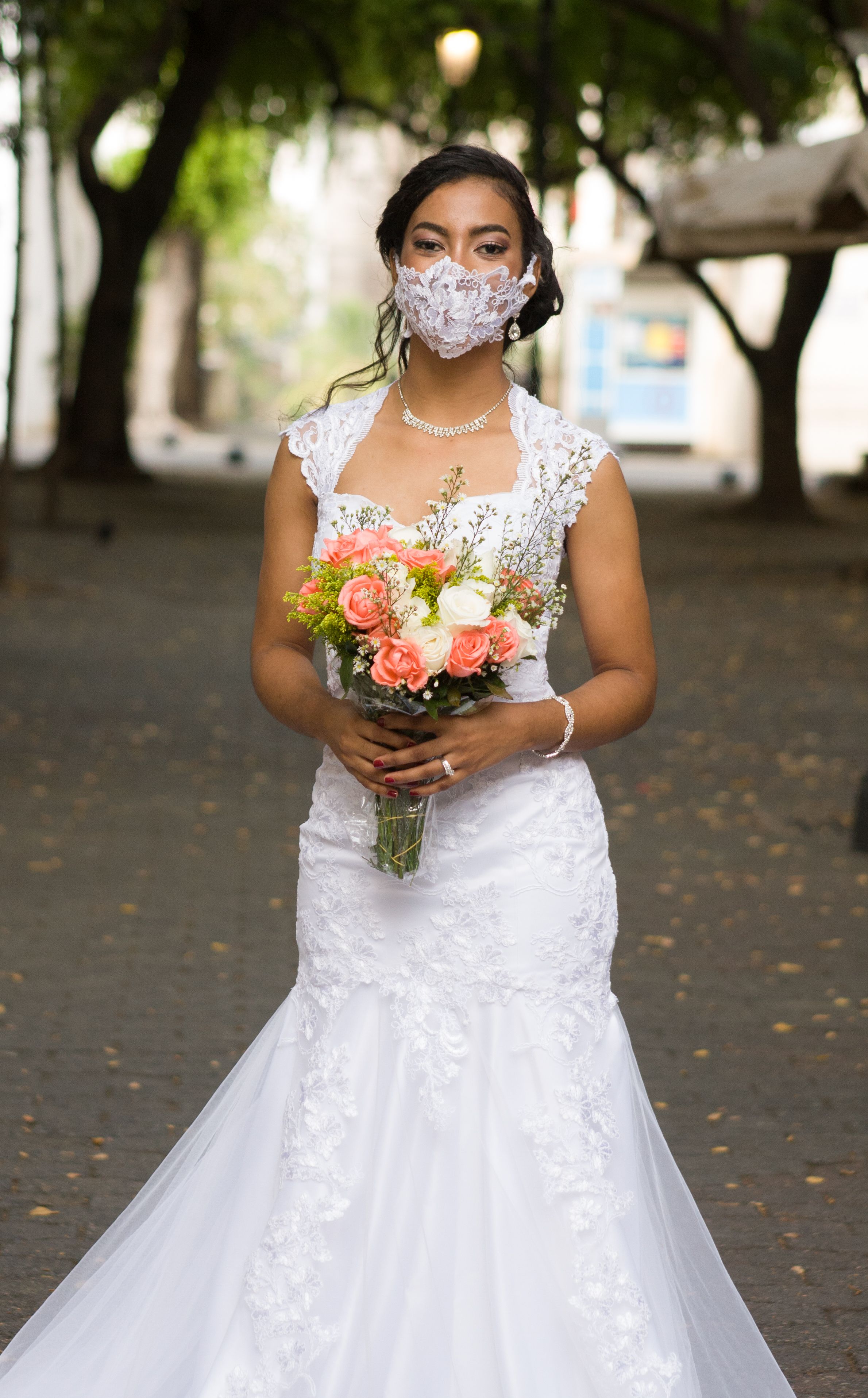 Woman in White Wedding Dress Holding Bouquet of Flowers · Free Stock Photo