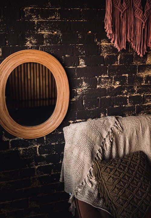 Free Wooden Wall Mirror on a Brick Wall Stock Photo