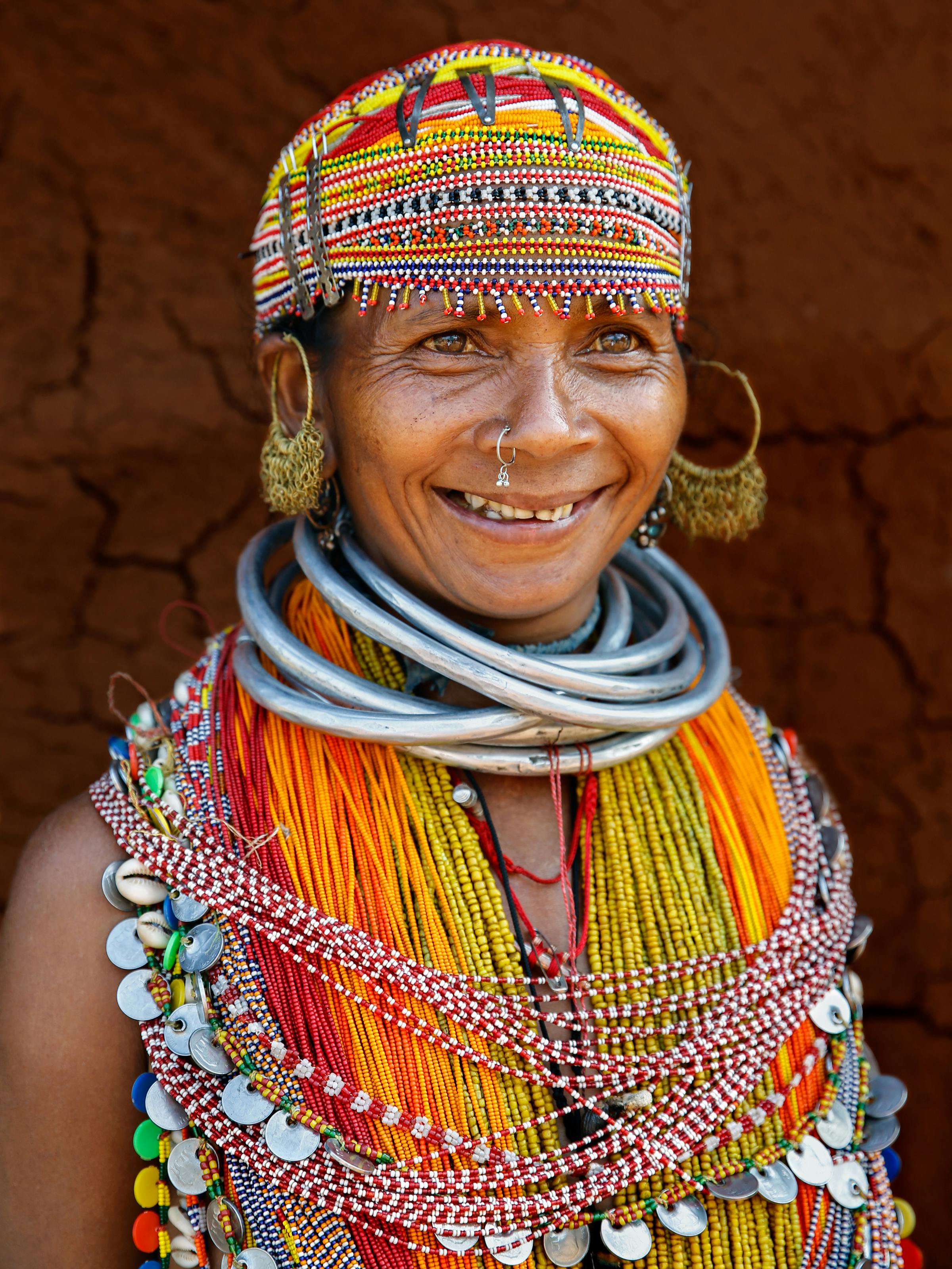 Vibrant portrait of a Bonda woman in traditional jewelry and attire, Odisha, India.