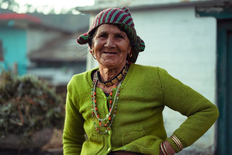 Woman In Green Sweater Smiling