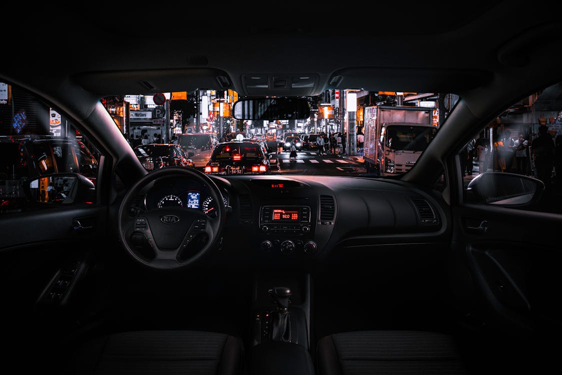Free Black Car Steering Wheel and Interior during Night Time Stock Photo