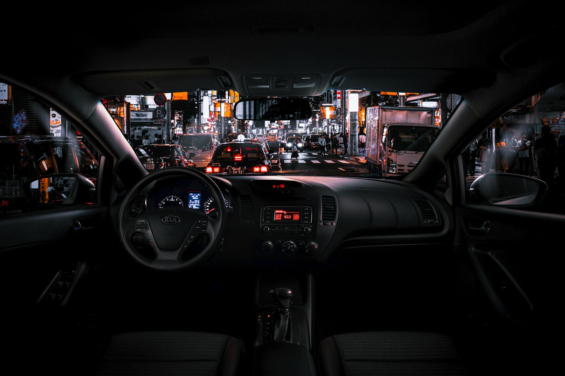 Black Car Steering Wheel and Interior during Night Time