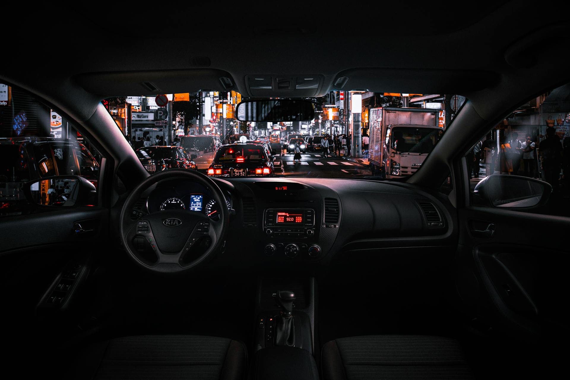 Black Car Steering Wheel and Interior during Night Time