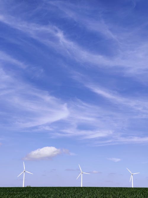 Free White Wind Turbines Under Blue Sky and White Clouds Stock Photo