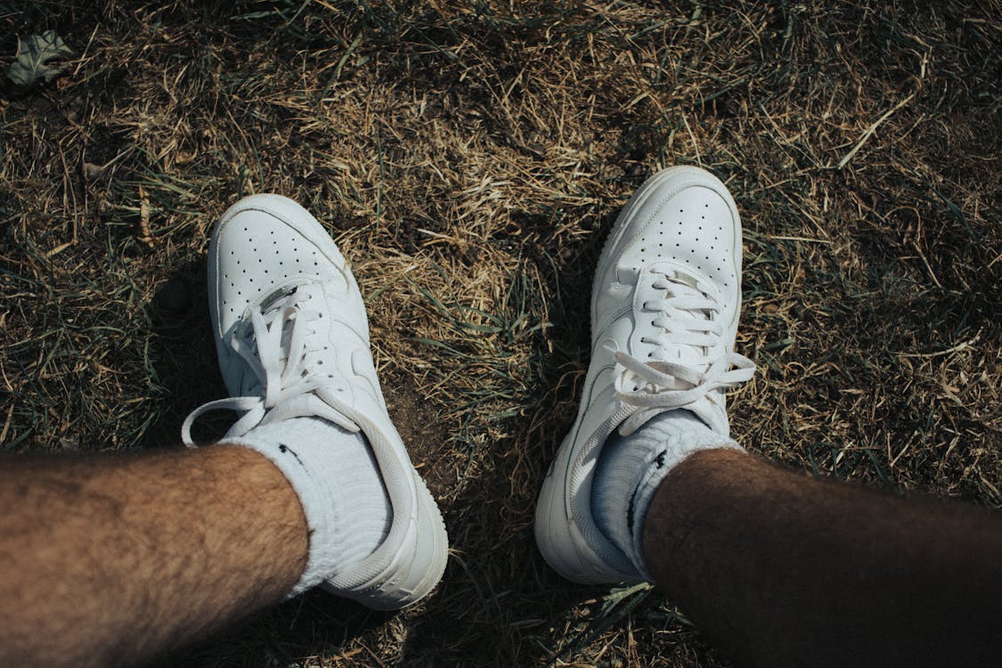 Person Wearing White Nike Sneakers · Free Stock Photo