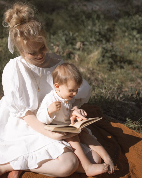 Free Photo of Mother and Baby Reading a Book Stock Photo