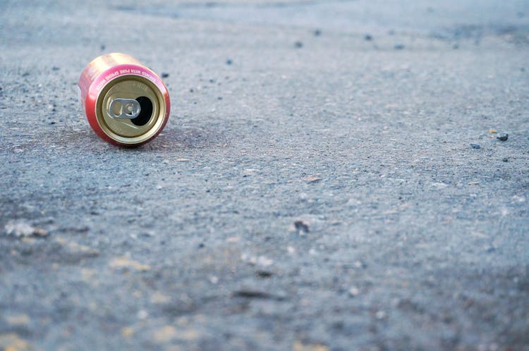 Photo Of Empty Soda Can On Concrete Floor