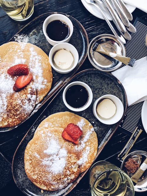 Free Appetizing pancakes served on tray with sauces Stock Photo