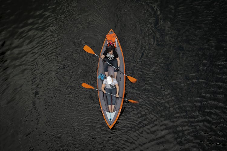 Top View Of A Couple Kayaking In A Lake