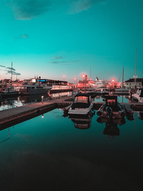 Boats parked in port in evening