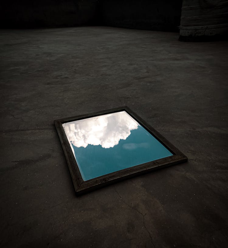 Framed Photo Of White Clouds In Blue Sky On The Floor