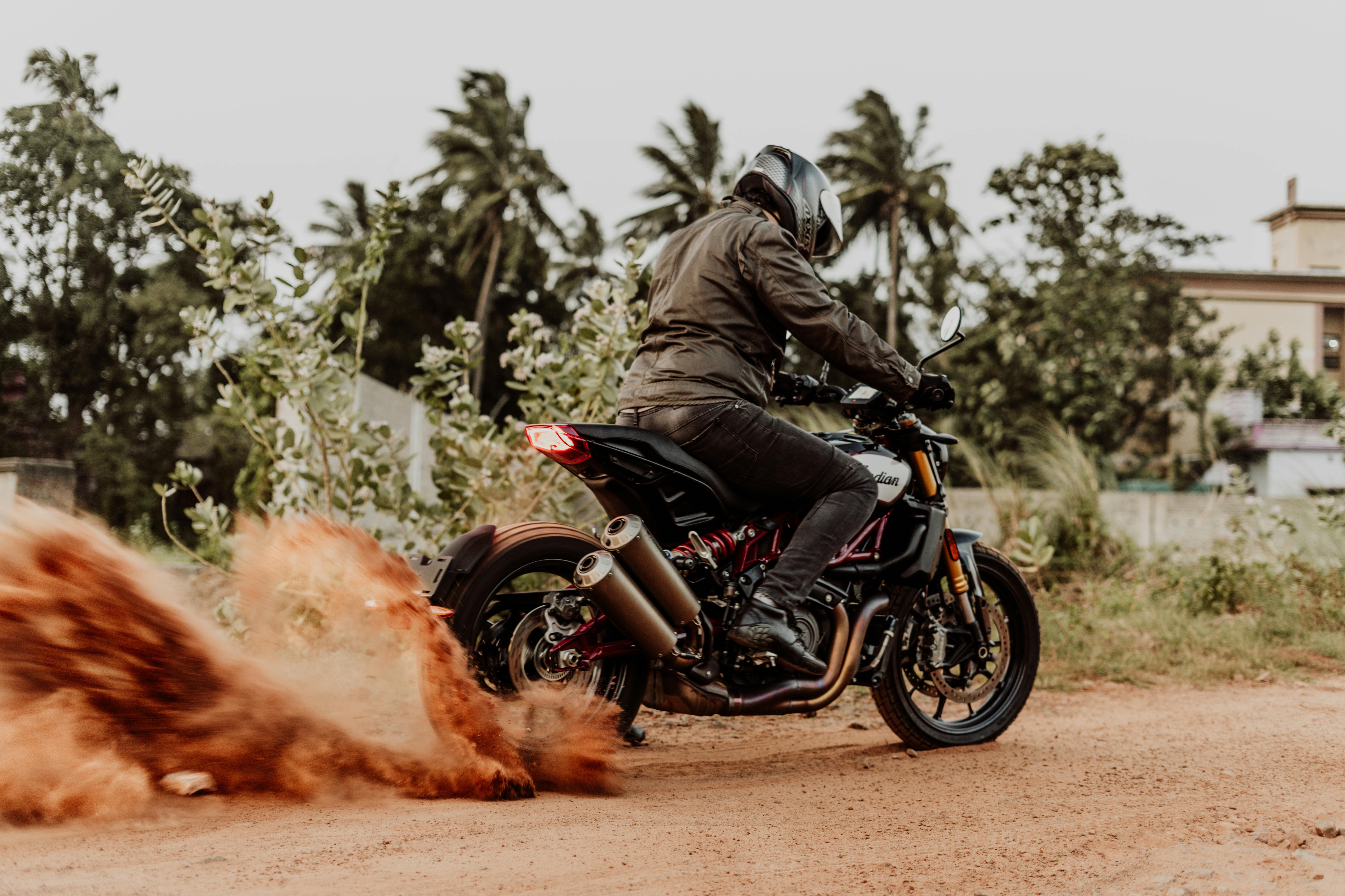 Man in Black Jacket Riding on Black Motorcycle