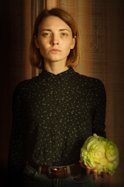 Free Photo of Woman in Black Long Sleeves Holding Cabbage Stock Photo