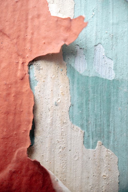Textured weathered wall with colorful dye