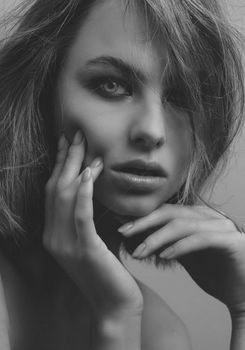 Striking monochrome portrait capturing a woman's thoughtful expression.