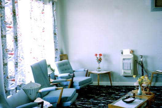 Classic mid-century living room with vintage furniture and floral curtains.