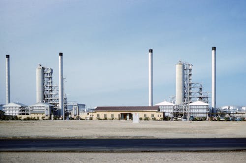 Free White and Gray Factory Under Blue Sky Stock Photo