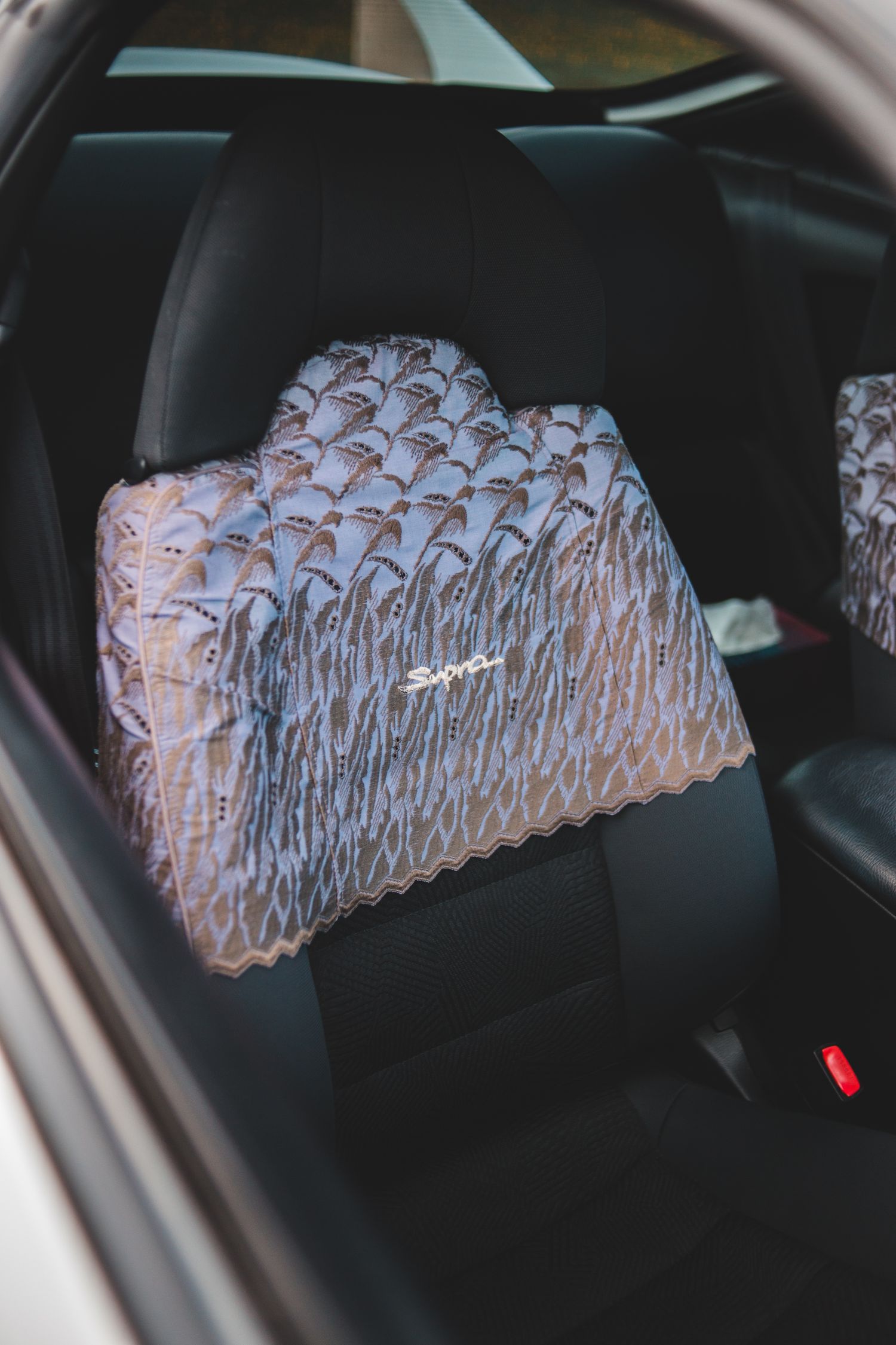 Refined vehicle seat interior with clean upholstery and uncluttered surroundings