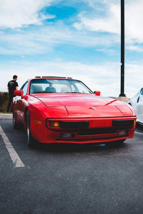 Free Photo of Red Car Parked on Parking Lot Stock Photo