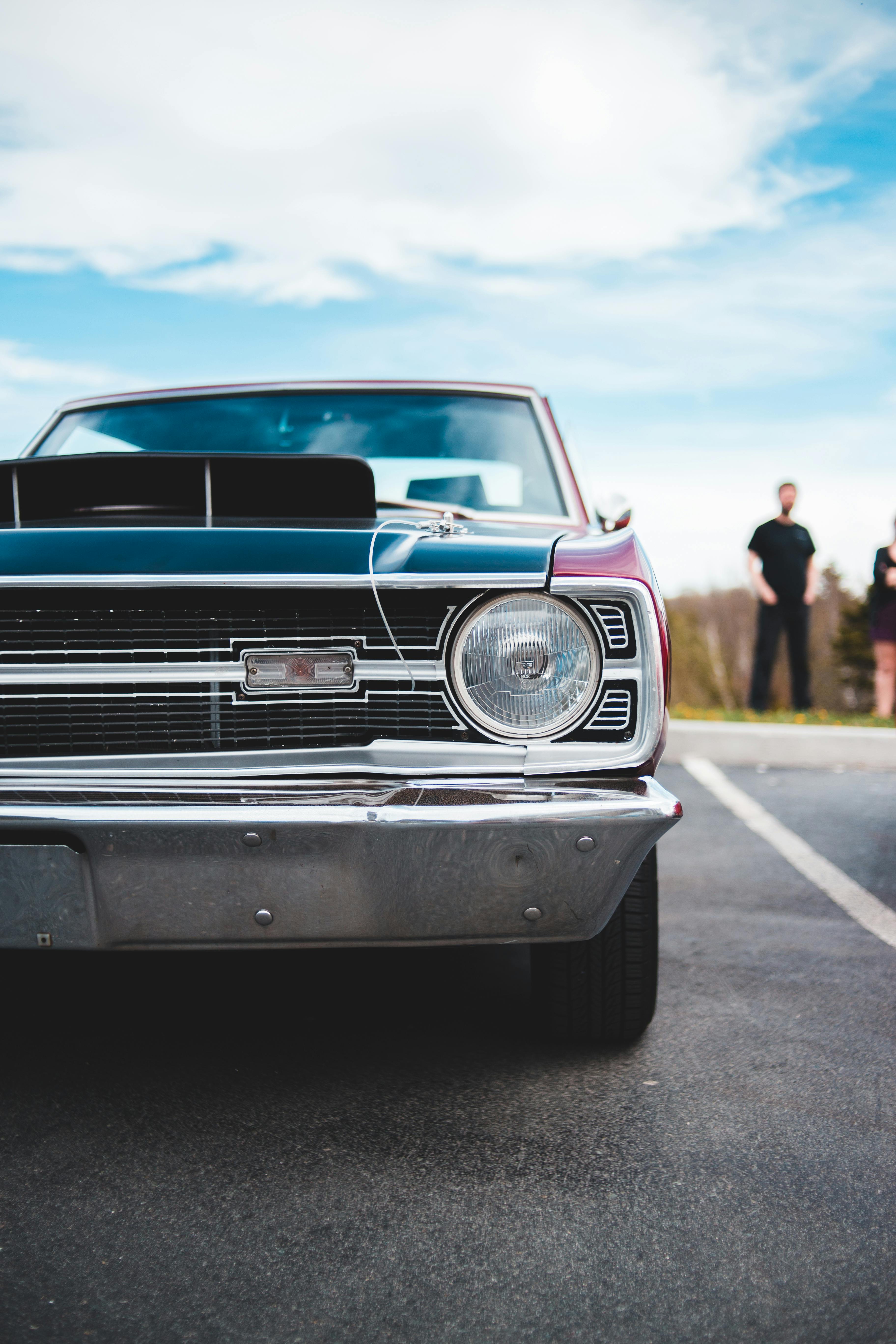 Photo of Classic Car Parked on Parking Lot · Free Stock Photo