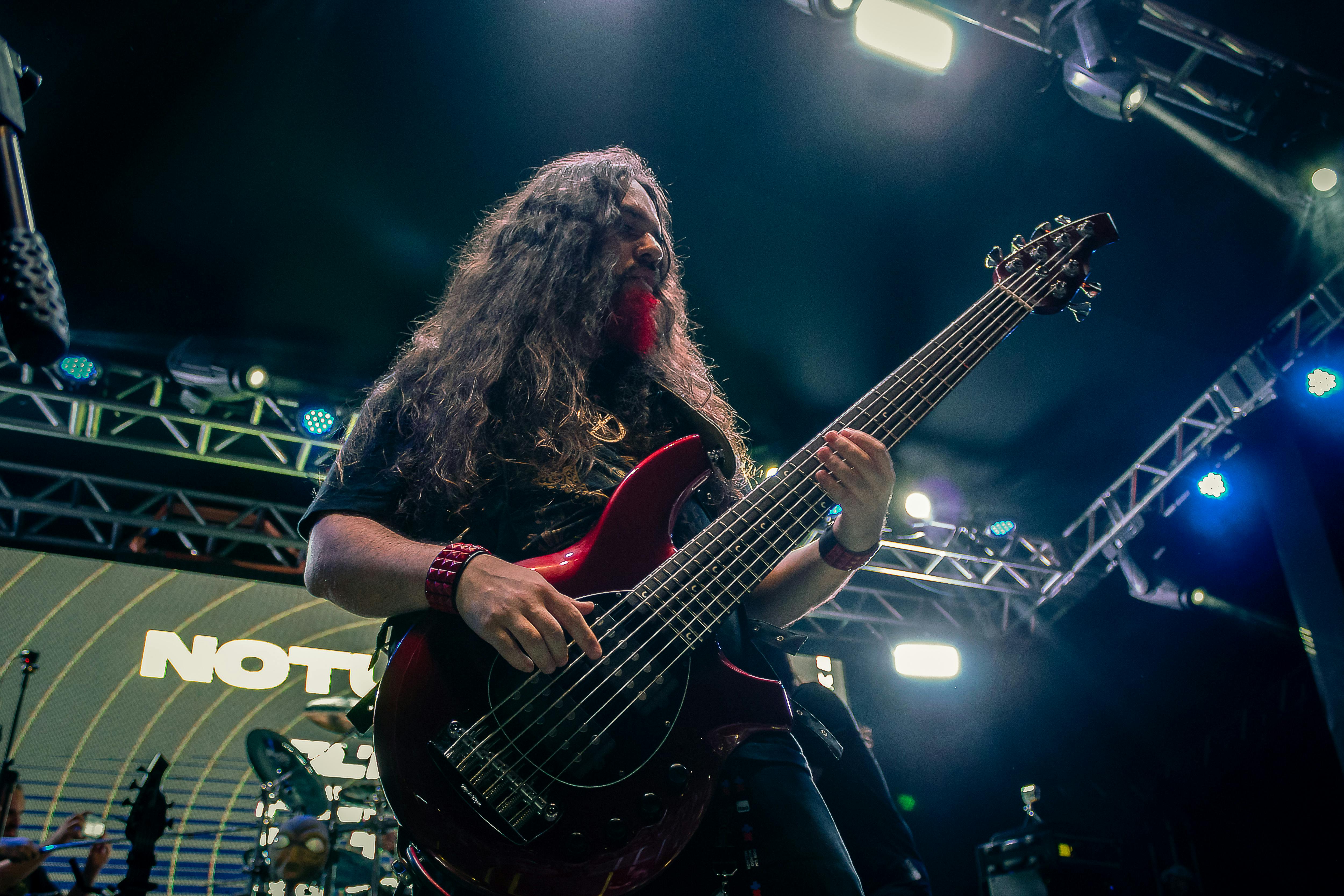 a man playing an electric guitar