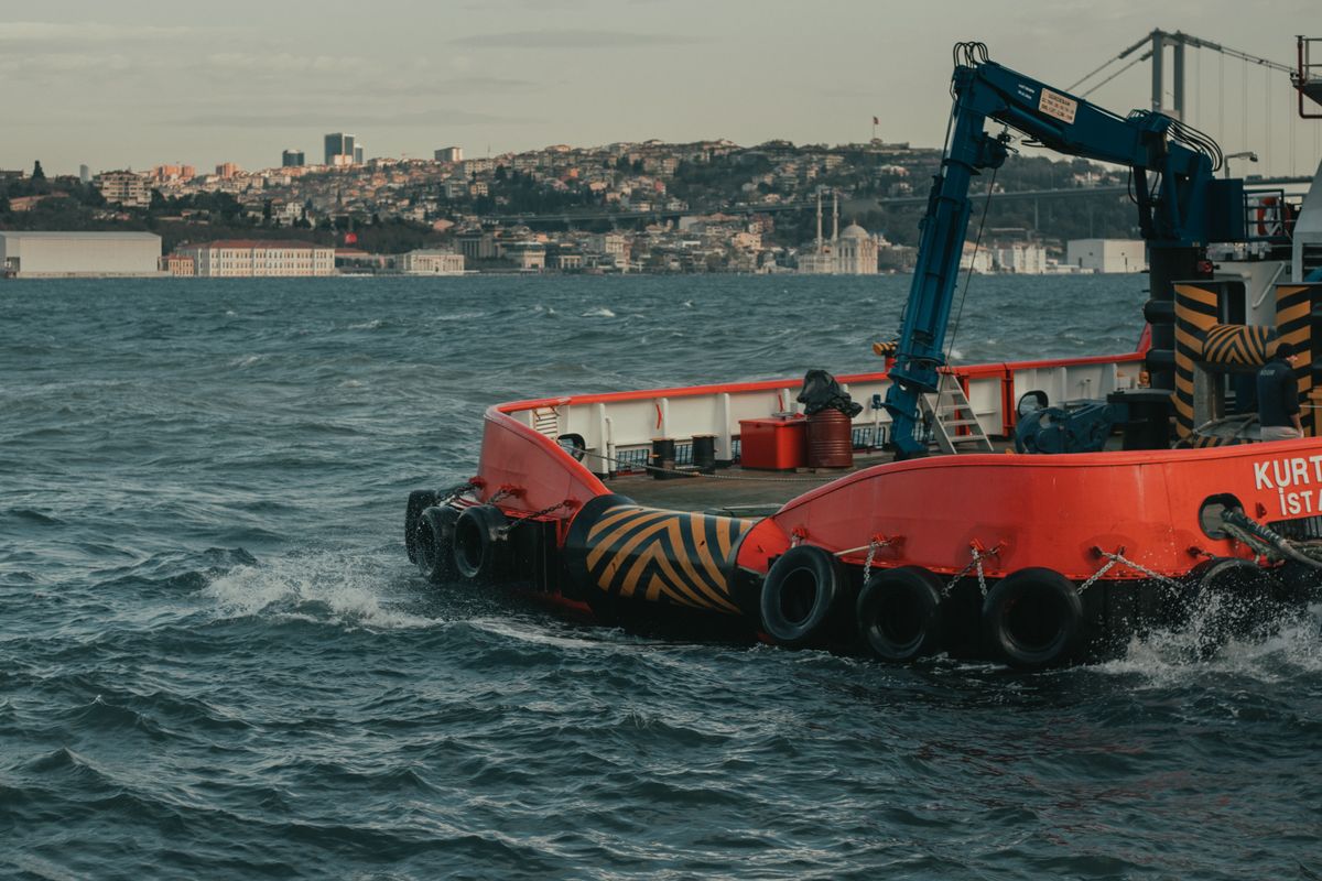 Crane and equipment on a ship in a coastal bay