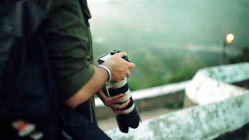 A Person Holding a Digital Camera