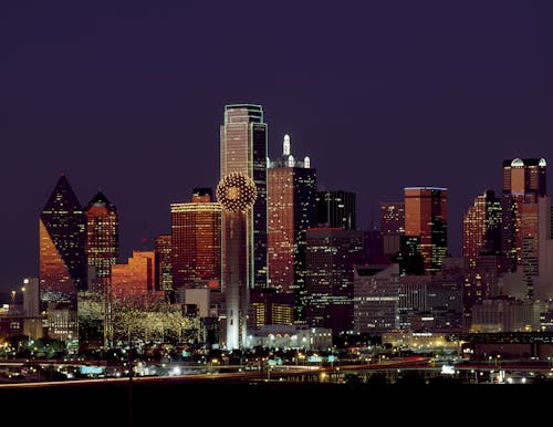 Free Brown Building With Lights on During Night Time Stock Photo