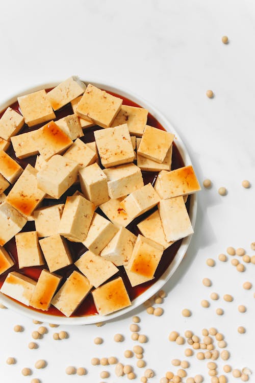 Sliced Tofu With Soy Sauce on White Ceramic Plate